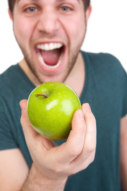 Man with apple and mouth open