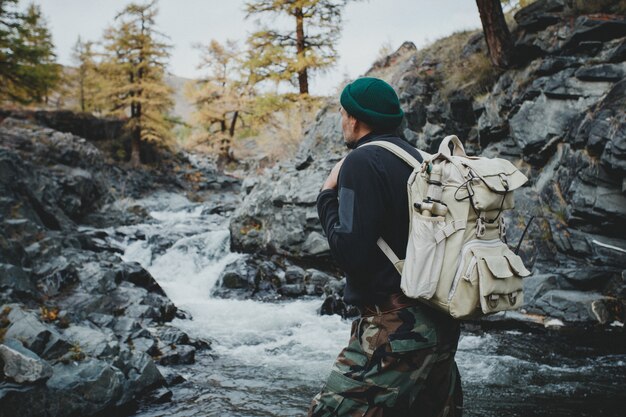 Man with a backpack in the forest