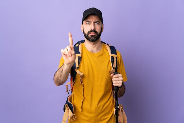 Man with a backpack in studio