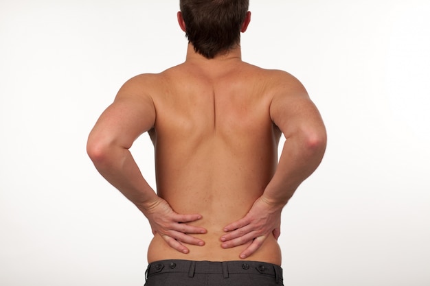 Man with backpain isolated agasint white