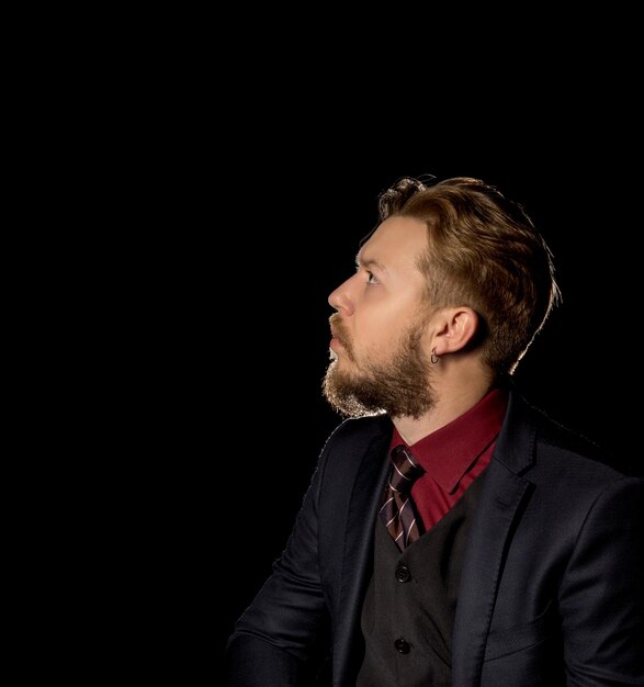 Man with a beard on a black background