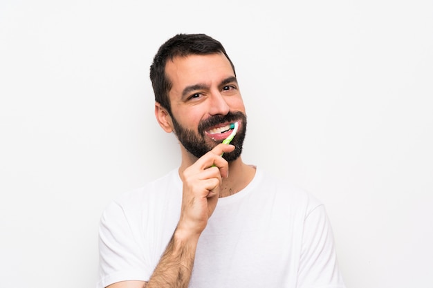 Man with beard brushing teeth