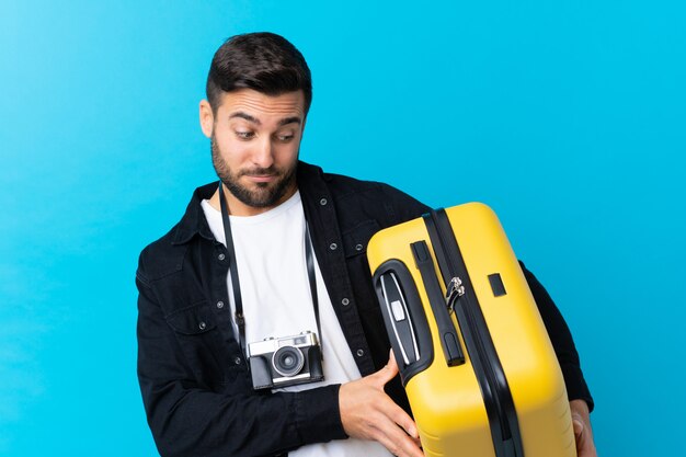 Man with beard going to travel over isolated wall