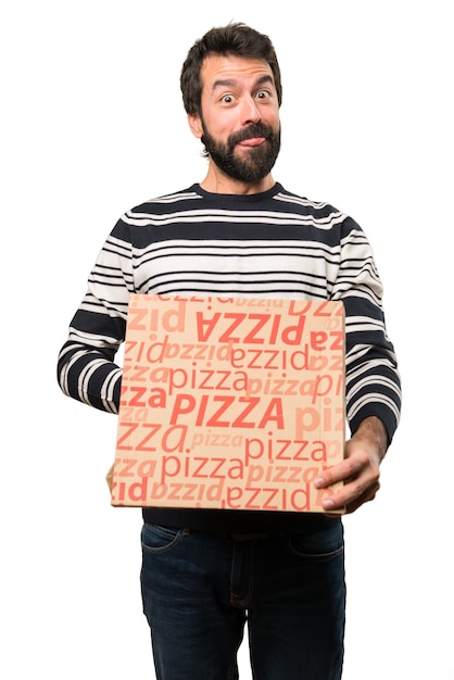 Man with beard holding pizzas