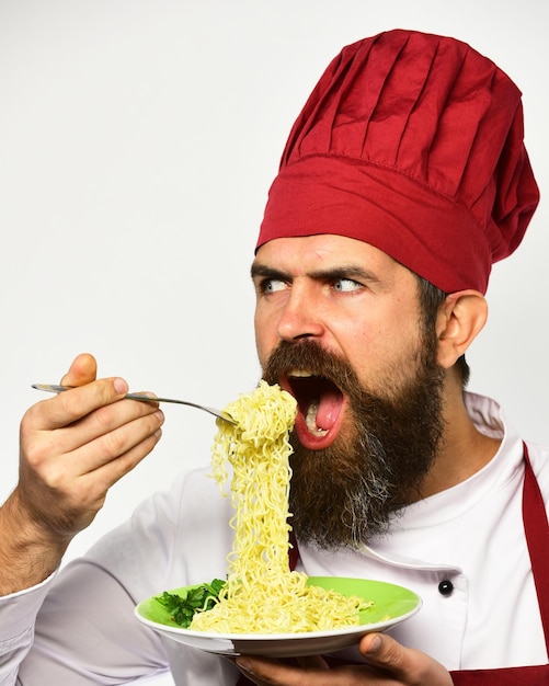 Photo man with beard holds tasty dish on white background