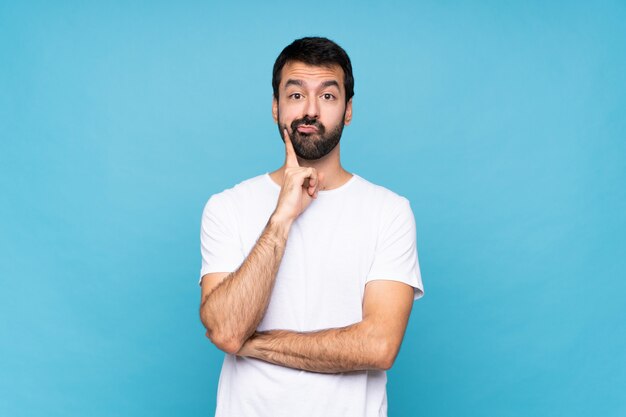 Man with beard over isolated wall