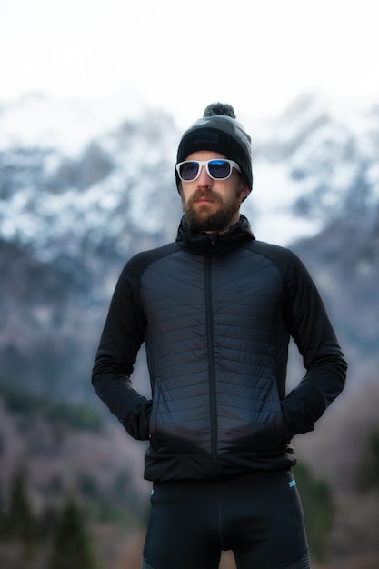 Man with beard mountaineer portrait only the mountains