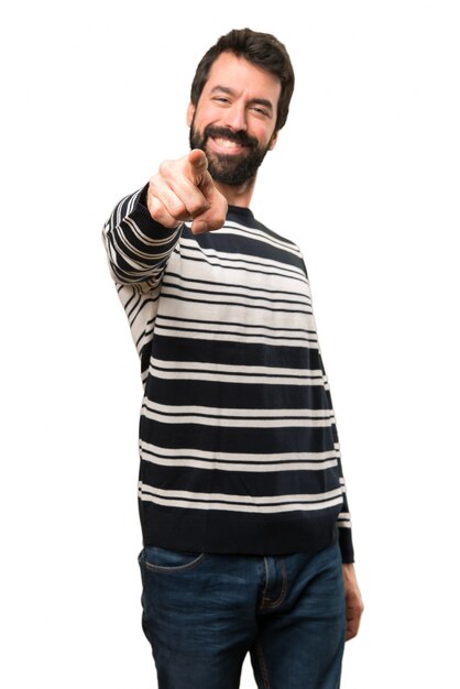 Man with beard pointing to the front