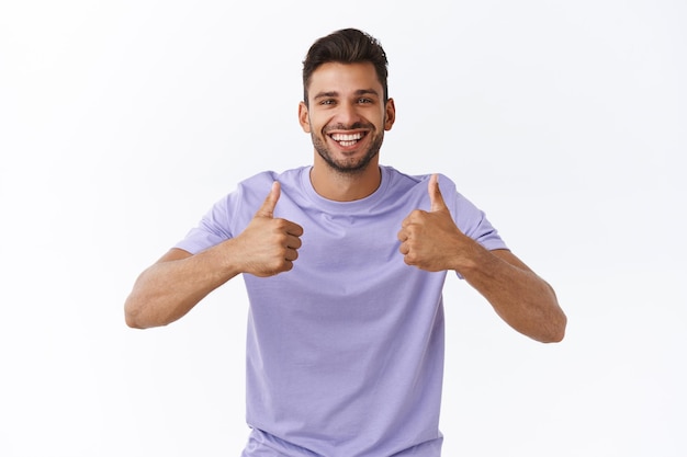 man with beard in purple t-shirt, show thumbs-up in approval or recommendation gesture