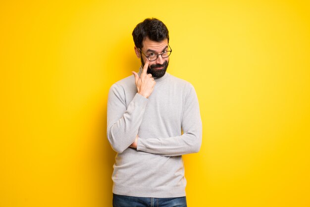 Man with beard and turtleneck looking to the front