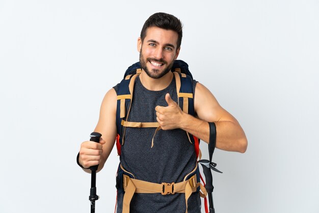 Man with a big backpack in studio