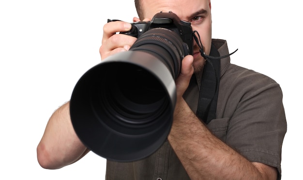 man with big camera lens on white