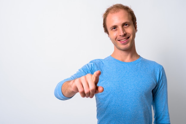 man with blond hair against white space