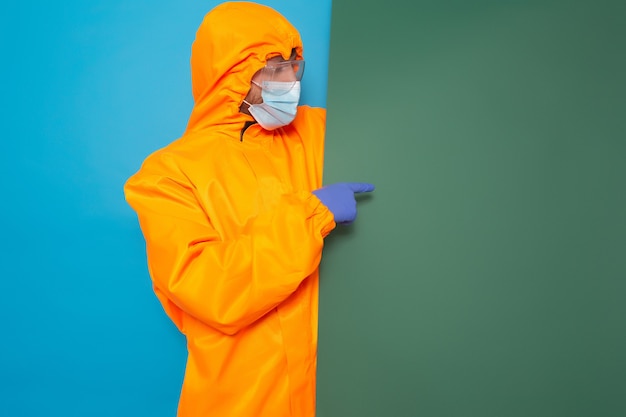 Man with blue and green paper banner