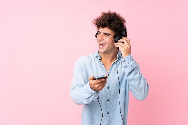 Man with blue shirt posing