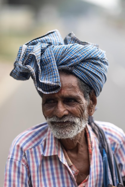 A man with a blue turban on his head