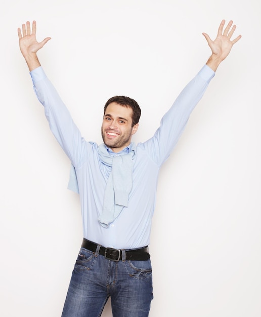 Man with both hands raised in the air