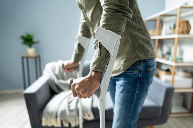 Man With Broken Leg Walking On Carpet