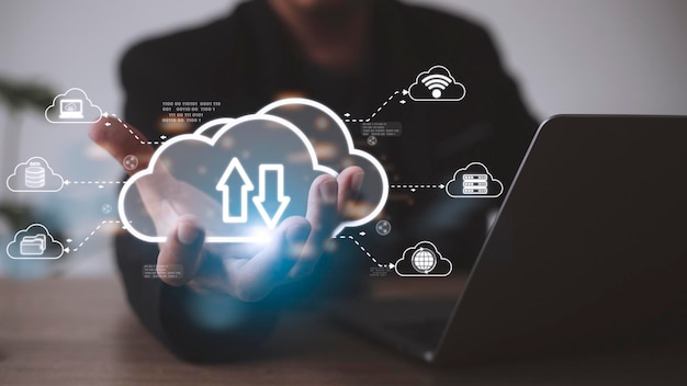 Man with cloud computing diagram show on hand cloud technology\
data storage networking and internet service concept