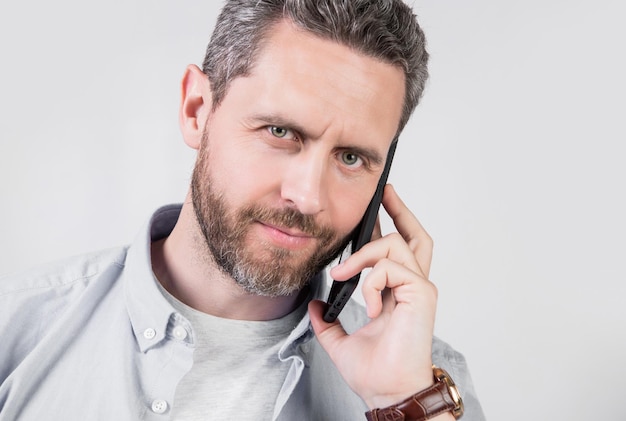 man with communication call in studio communication call of man photo of man having communication call man has communication call on smartphone isolated on studio background