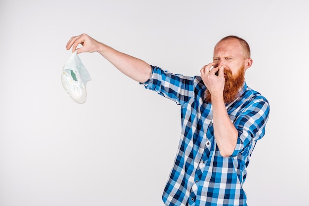 Man with diaper on white background emotion and people concept