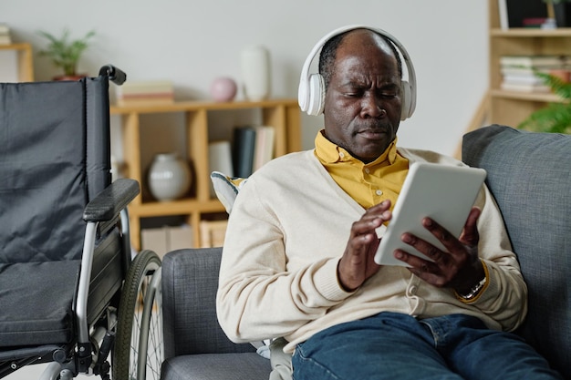 Man with disability listening to music