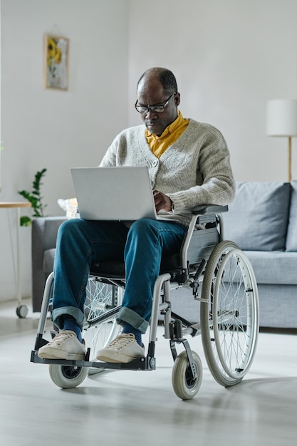 Man with disability using laptop