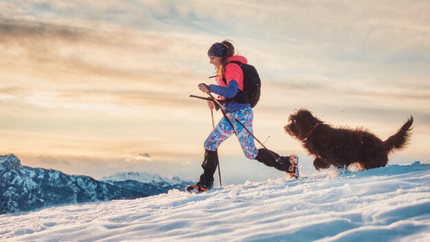 Man with dog in snow