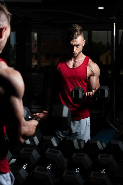 Man With Dumbbells Exercising Biceps