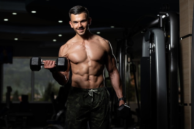 Man With Dumbbells Exercising Biceps