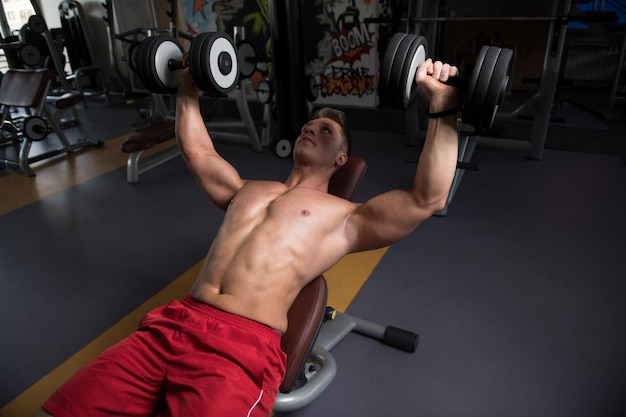 Man With Dumbbells Exercising Chest