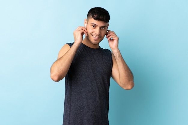 Man with earbuds in studio