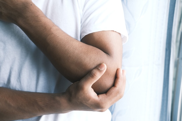 Man with elbow pain pain relief concept