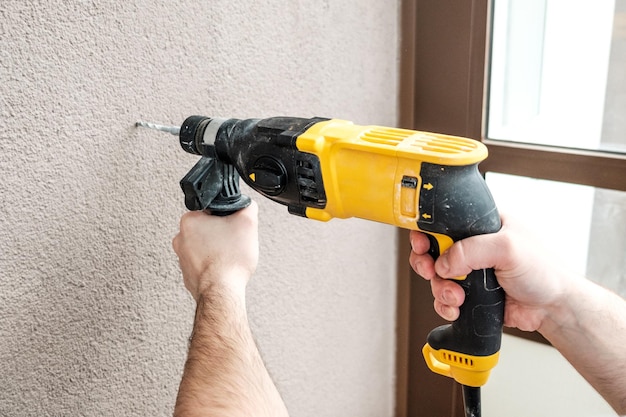 Man with electric drill