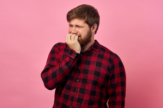 Man with emotions on his face and a beard