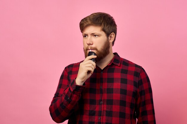 Man with emotions on his face and a beard