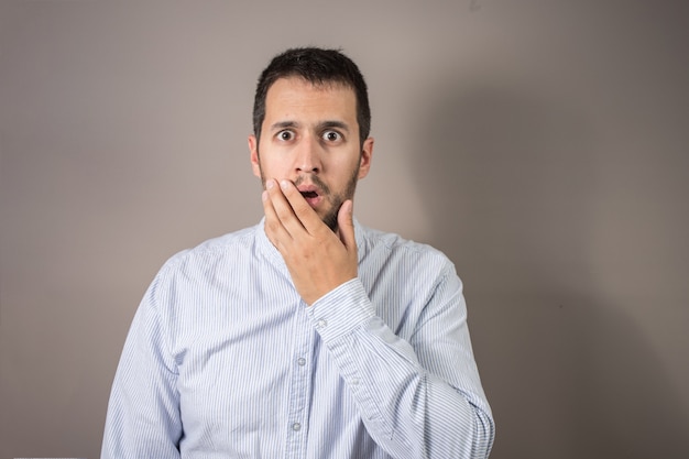 Man with expression of amazement and hands on his head