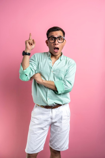 Man with eyeglasses and a shirt standing