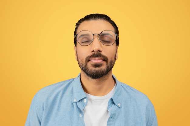 Man with eyes closed in a peaceful expression