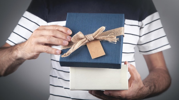 Man with gift box. Christmas. Surprise