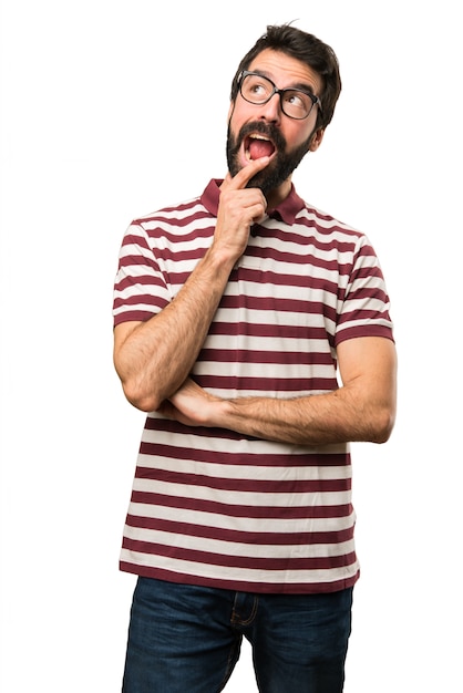 Man with glasses making surprise gesture