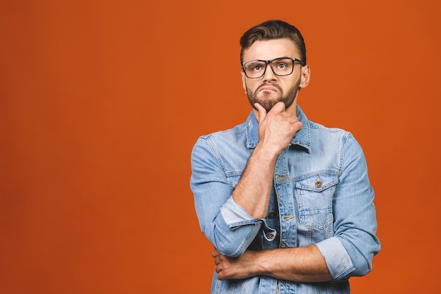 Man with glasses posing in studio