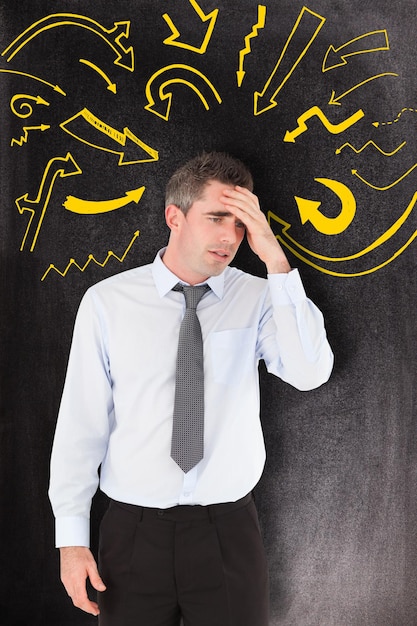 Man with headache against black background