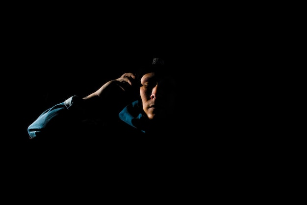 Man with headphones in the dark