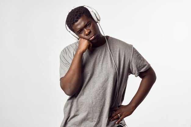 Man with headphones listening to music african appearance\
entertainment