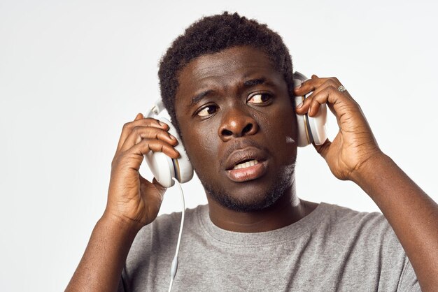 Man with headphones listening to music african appearance entertainment