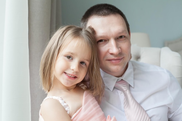 Man with his little cute girl Happy Father's Day