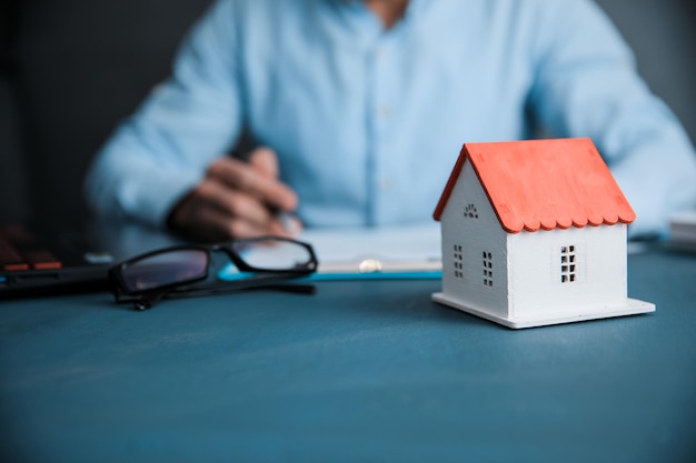 Man with house model