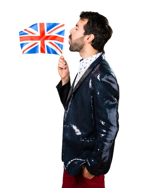 Man with jacket holding an UK flag