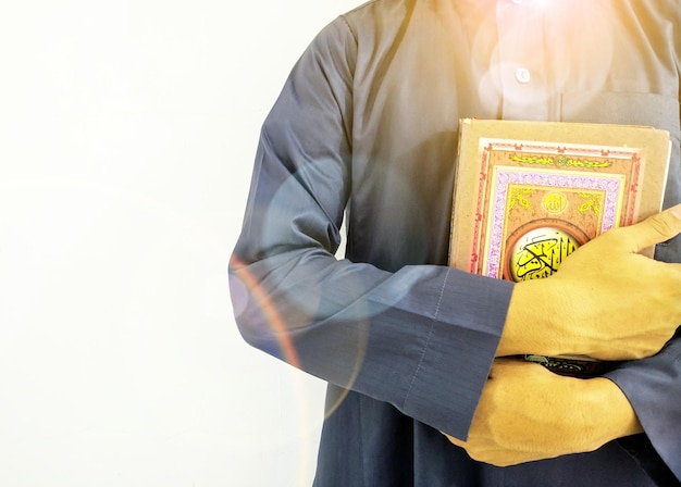man with Koran holy book of Muslims